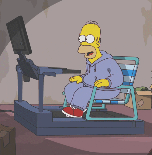 Man sitting on a char on a treadmill exercises