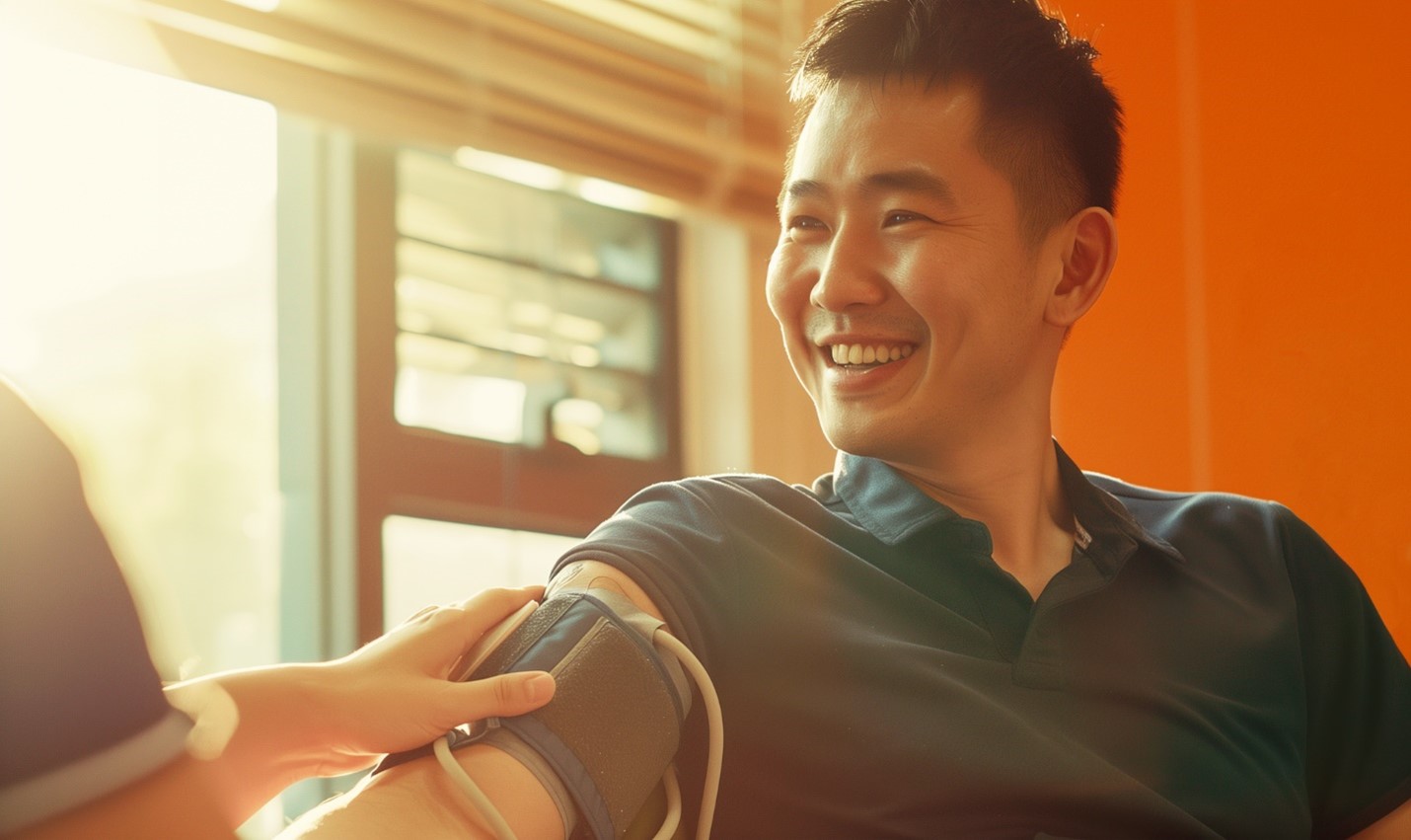 Man having a blood pressure check in an orange room