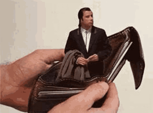 Confused John Travolta in a wallet meme